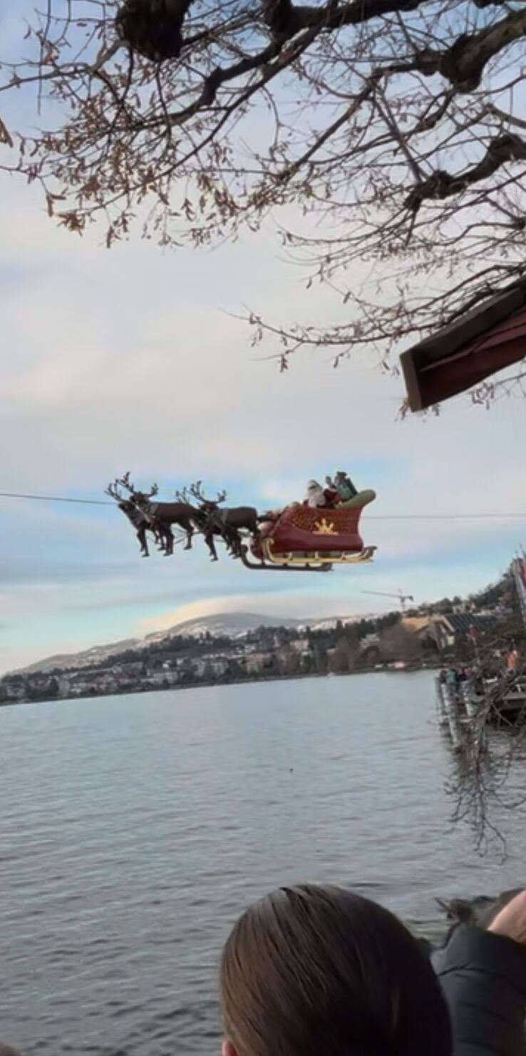 Santa and his sleigh flying over Lake Geneva at Montreux Noël